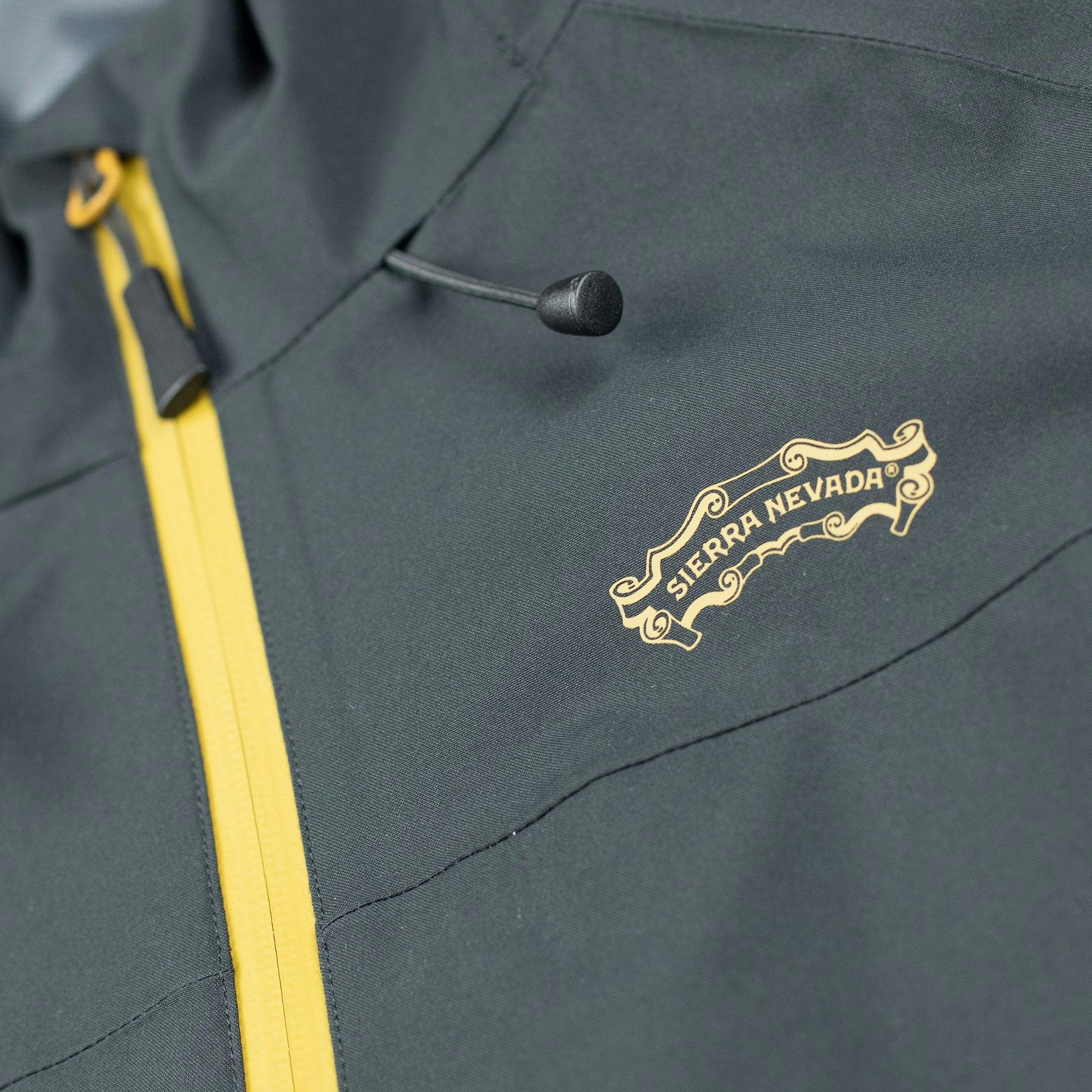 Detail view of the Sierra Nevada Brewing Co. scroll logo on the Men's Rain Jacket