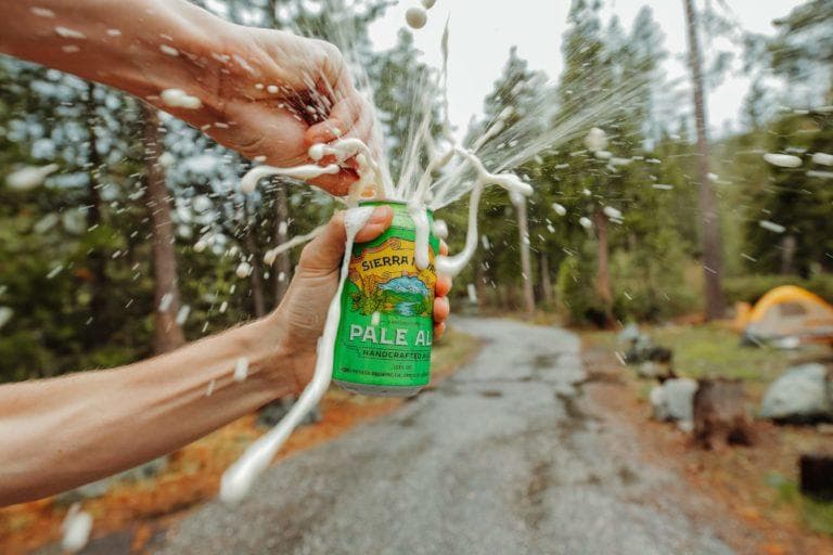 Pale Ale can being opened outdoors