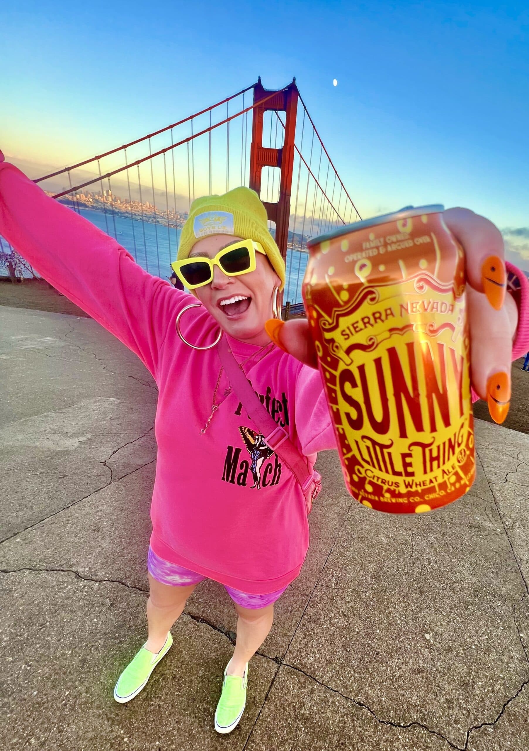 Abby Wren in colorful makeup poses with Sunny Little Thing