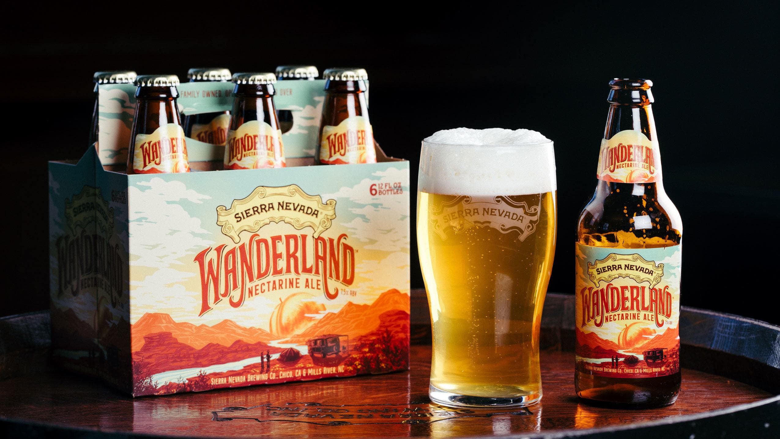 Bottles of Wanderland Nectarine Ale on packaging line