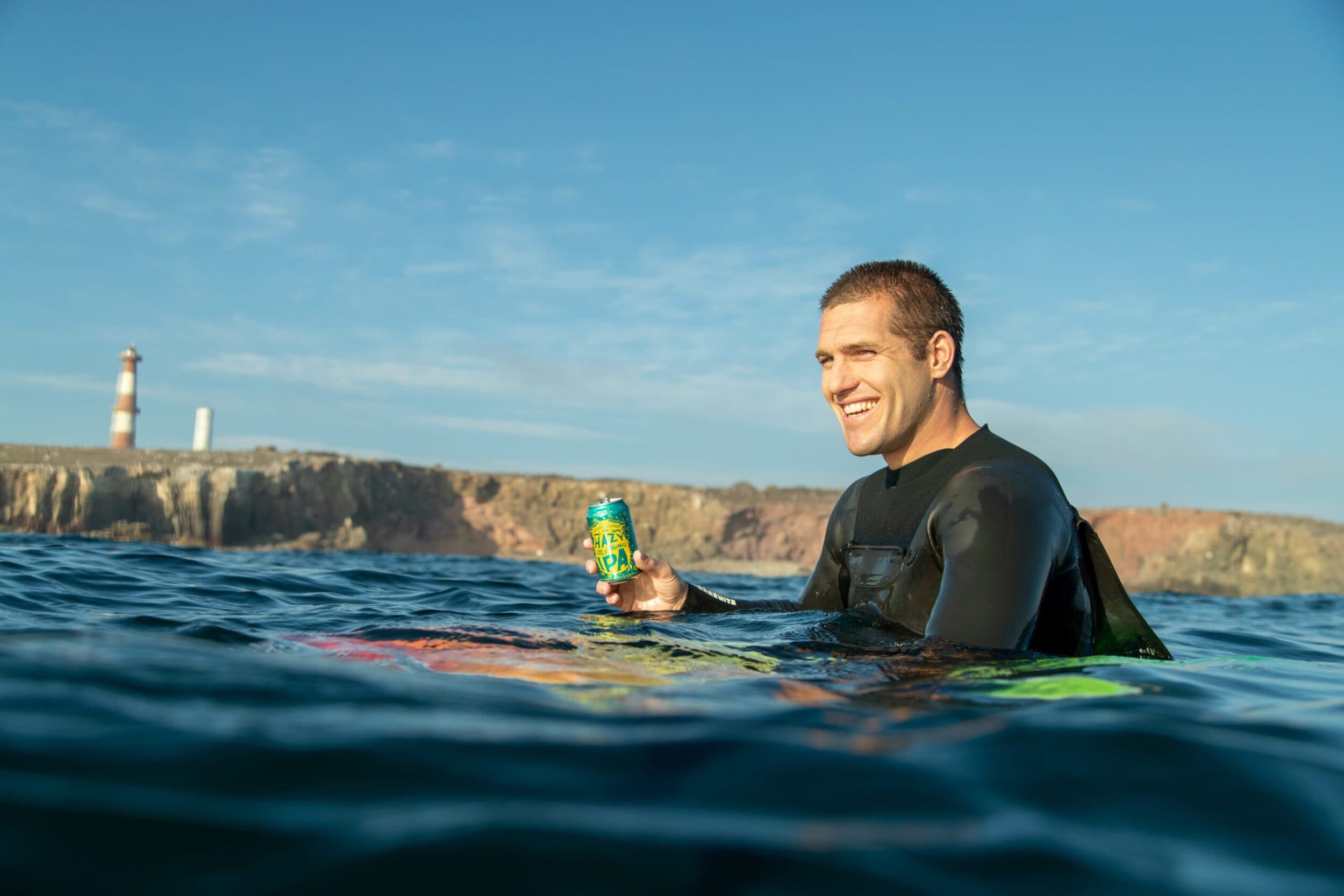 Jojo on surfboard in water