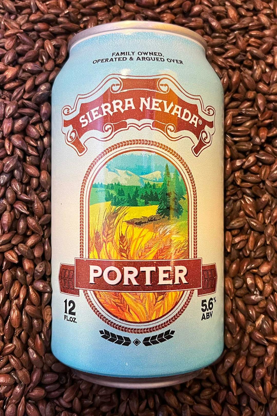 A can of Sierra Nevada Porter resting in a bed of dark roasted barley