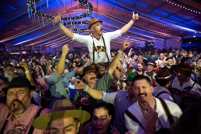 People in costume enjoy Oktoberfest