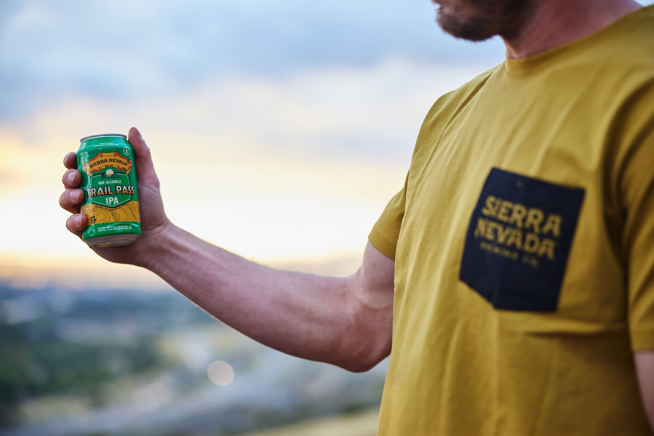 Trail Pass IPA can being held outside