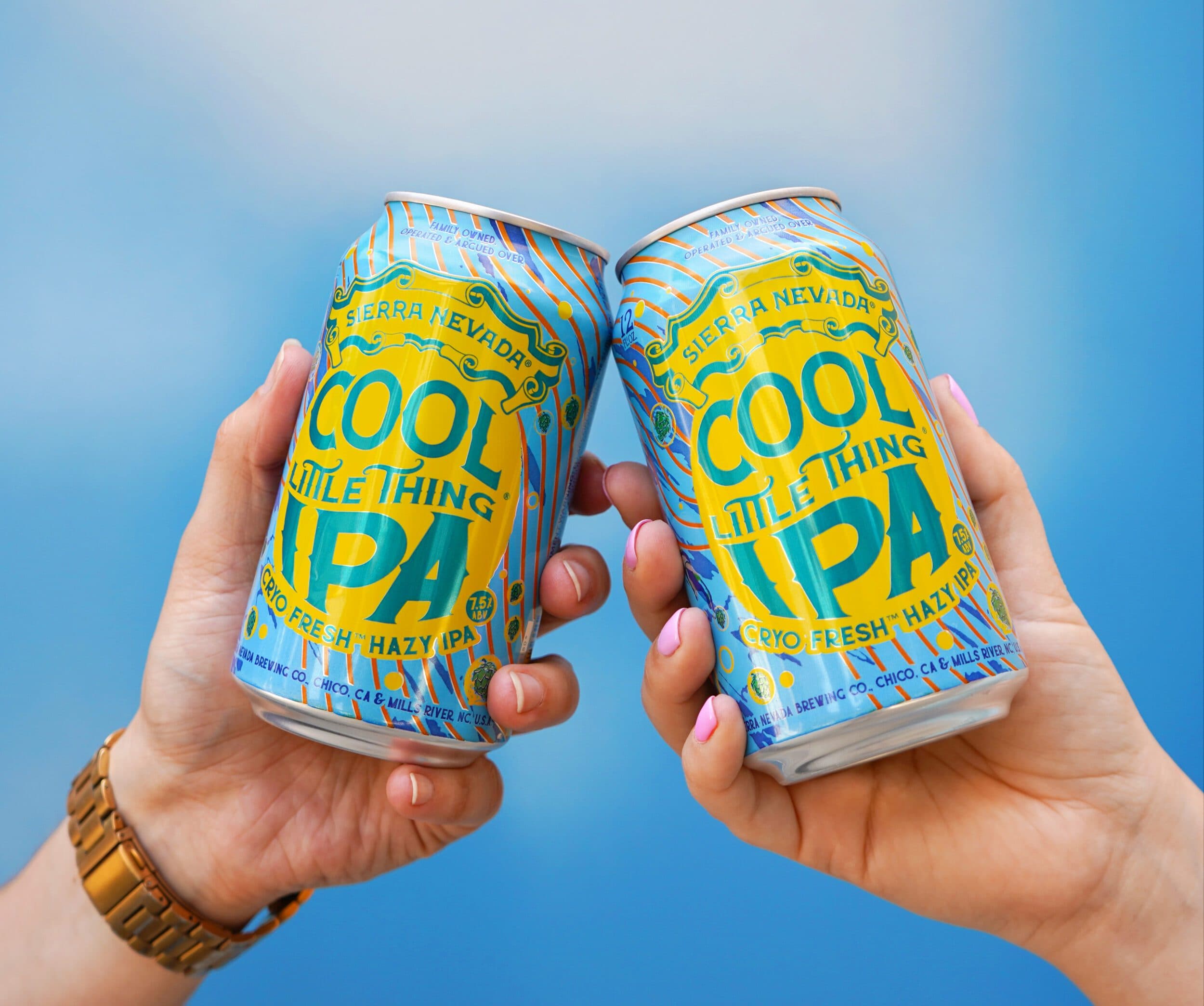 Cool Little Thing cans being cheersed together