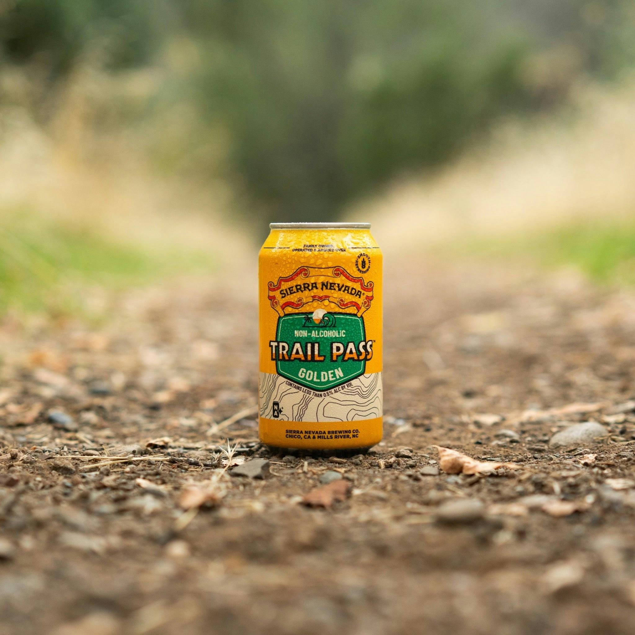 Sierra Nevada Brewing Co. Trail Pass Golden Non-Alcoholic Brew - A chilled can of Trail Pass Golden sits in the middle of a hiking trail