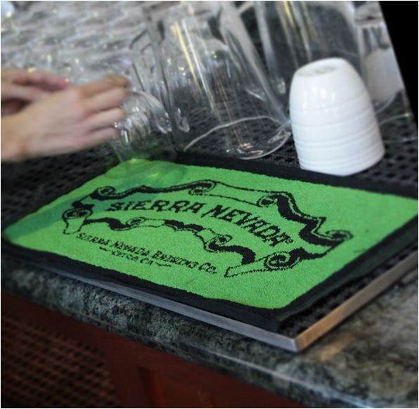 Dark Green Sierra Nevada Bar Towel on bar counter