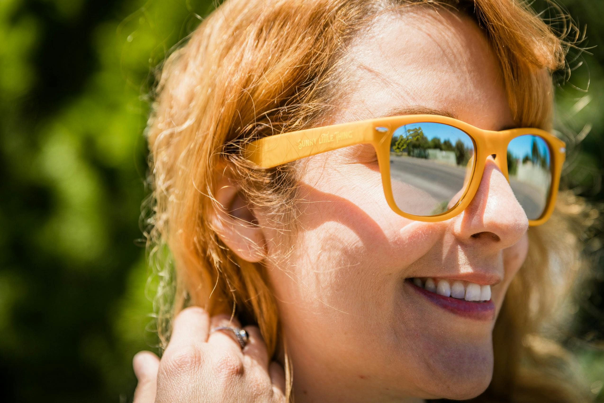 Woman wearing sierra nevada sunny little thing citrus wheat ale sunglasses