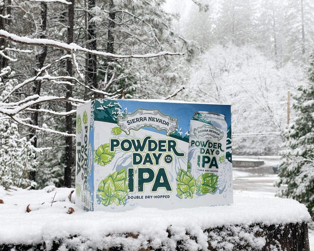 Pack of Powder Day IPA beer in snow
