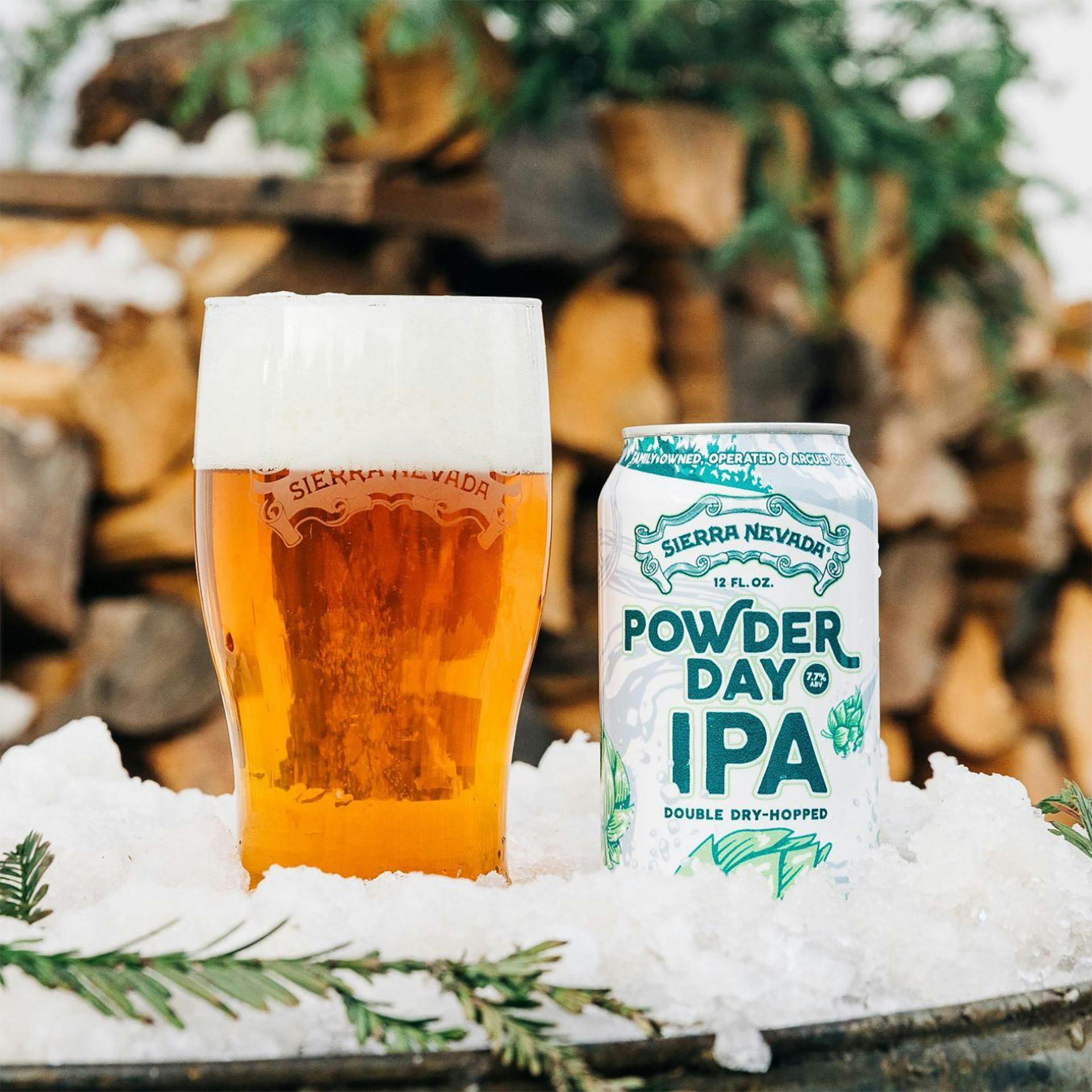 Powder Day IPA beer can and pint glass