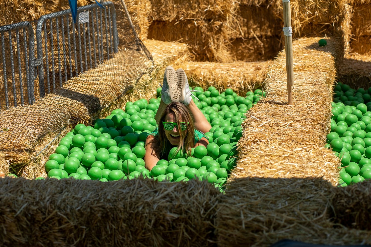 woman playing in the ball pit at beer camp