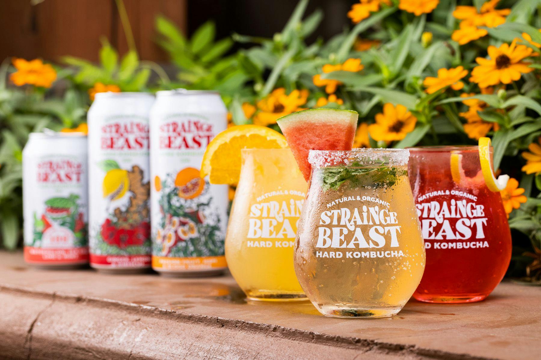 Three Strainge Beast flavors in glasses topped with garnishes