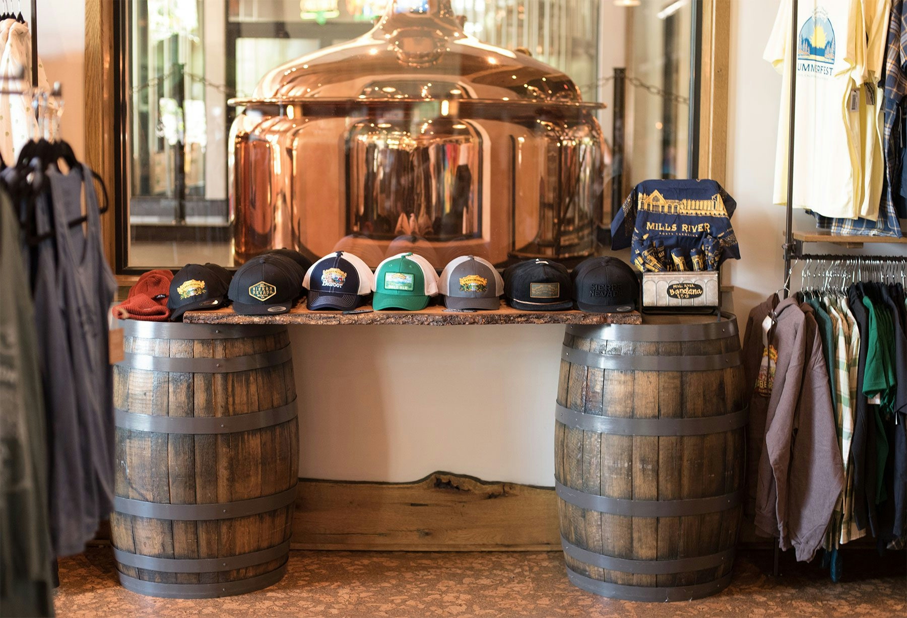 A table of hats inside the Sierra Nevada Brewing Co. gift shop