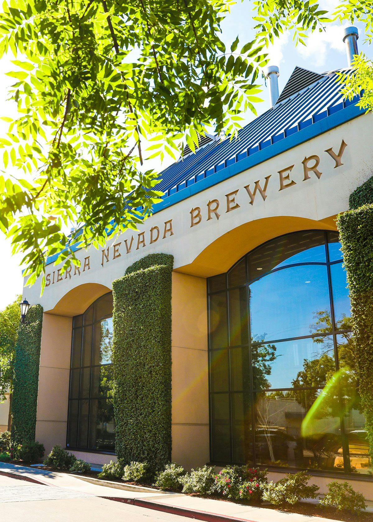 Trees frame the exterior of the brewhouse at Sierra Nevada Brewing Co.