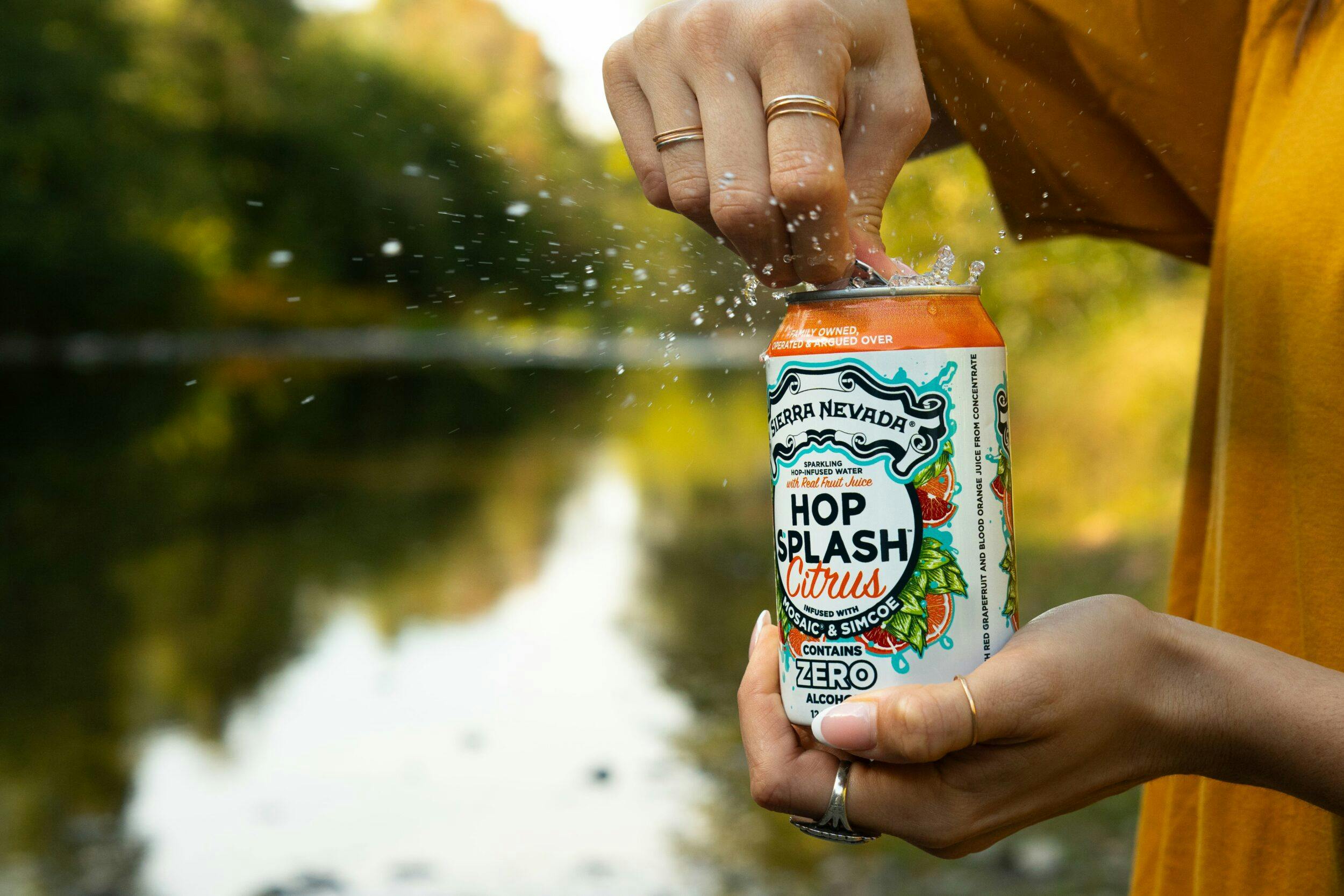 Hop Splash Citrus can being opened outside