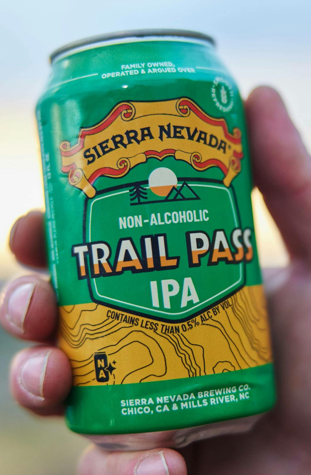 Trail Pass IPA can in hand